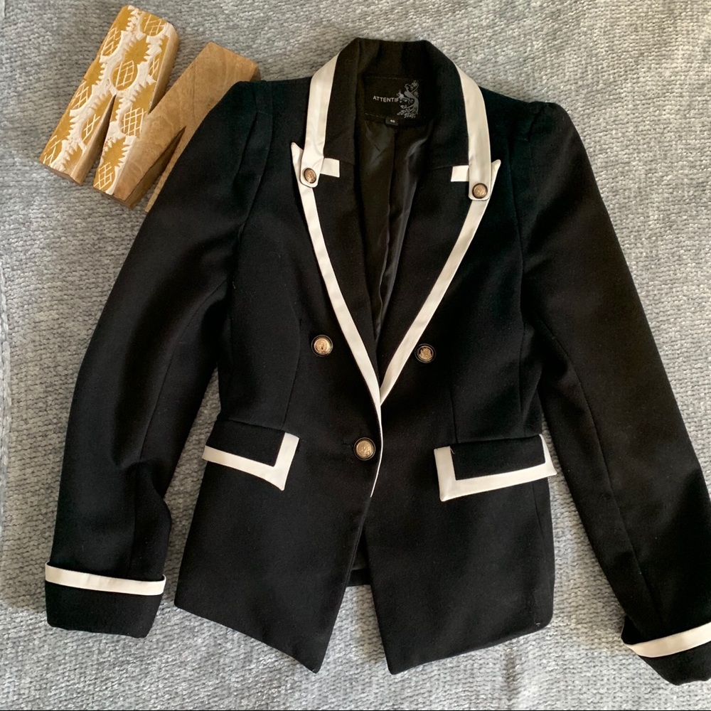 Black and white suit jacket with gold buttons
